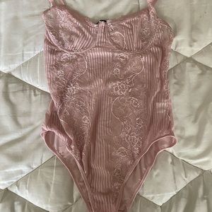 Pink lace body suit